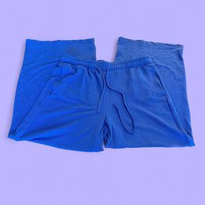 Blue flowy pants with drawstring waistband and side pockets